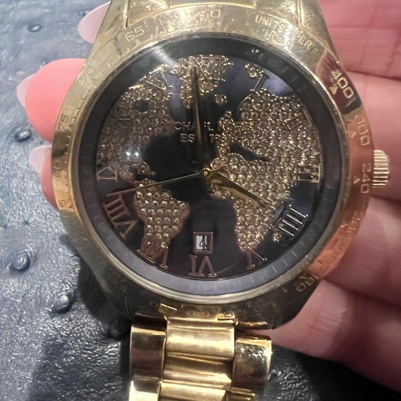 Used Michael Kors gold watch with blue background and map diamonds. - Picture 3 of 4